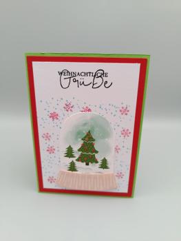 Weihnachtliche Grußkarte mit Schneekugel-Motiv